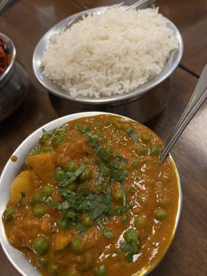 Aloo matar. Potatoes and peas in onion tomato coriander gravy. Absolutely delicious. Had with Roti.  at The Indian Cafe - Stoke in Nelson