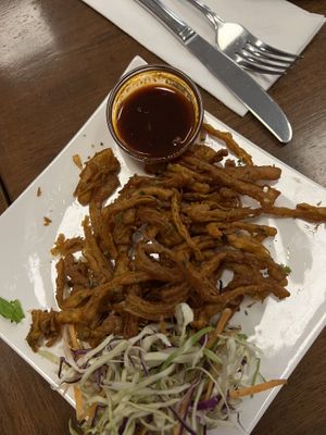 Onion Bajhi and tasty tamarind sauce  at The Indian Cafe - Stoke in Nelson