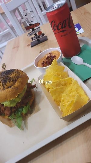 BBQ burger with a generous amount of guaccamole , hummus with sundried tomatoes and paprika and nachos to dip with. Really good! at Green M'ama in Naples