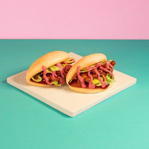 Pink Bao: Planted pulled marinated in BBQ sauce, iceberg lettuce, feta dressing, and homemade beet mayo at Green M'ama in Naples