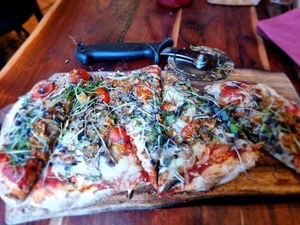 Cut it yourself wit pizza roller at Casa Di Kaspi in Bruges