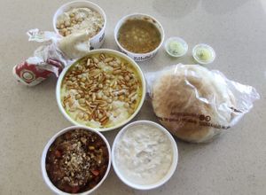 Moitabal, babaganoush, falafel sandwich, hummus, hummus fateh, foul and bread at Hamada - Suliman Al Nabulsi St in Amman