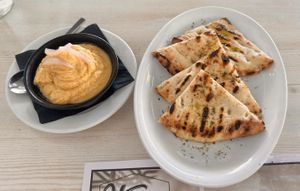 Hummus and pita. The pita bread was amazing and drizzled with olive oil.   at Vegera   in Mykonos