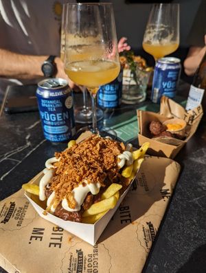 vegan 'Julientje': Belgian fries, satay seasoning, Flemish stew, mayonaise, sliced 'viandel' crispy sausage & crispy onions at OhMA Gent in Ghent