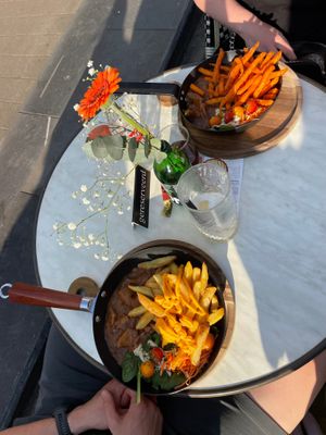 My boyfriend got the stew (large option) with cheezy fries for 25,50. His portion is below. at OhMA Gent in Ghent