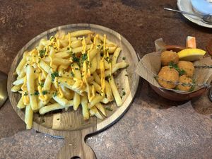 Cheesy chips and croquettes   at OhMA Gent in Ghent