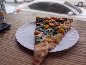 Tomato spinach with some bonus mac at Dimo's Pizza - Lincoln Square in Chicago