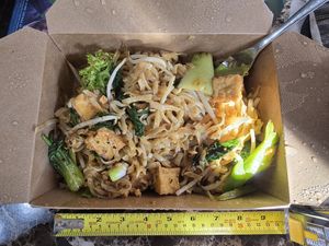 Pad thai, specify vegan, with tofu.  Generous carryout portion at Baan Thai Bistro in Indianapolis