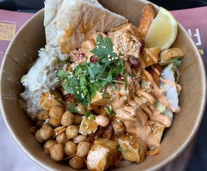 Tofu bowl with sweet potatoe fries and smoked aubergine   at Fattoush Urban Lebanese Kitchen in Leicester