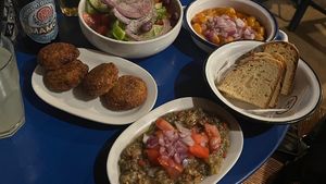Greek salad (without feta cheese), beans, chickpea burgers, eggplant saladd  at The Mills - Παραδοσιακό καφενείο "οι μύλοι" in Astypalaia
