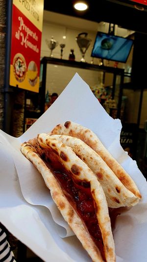 Pizza with olives and mushrooms at 'A Puteca d' 'a Pizza in Naples