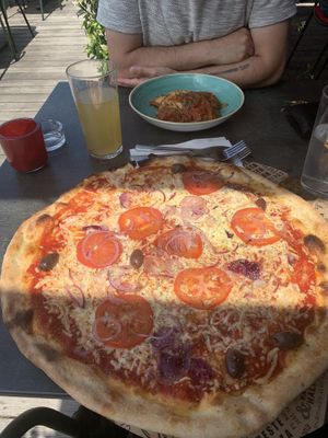 Pizza rustica with vegan cheese and ravioli filled with vegan tuna  at L'Osteria in Steyr