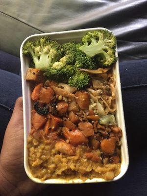 Dahl, broccoli, tofu stir fry, brown rice, carrots and who knows what else is packed in underneath. Delicious   at Planet Organic - Torrington Place in London