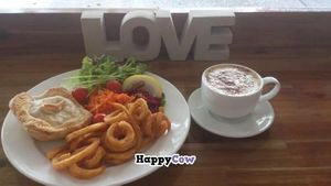 Heart gravy pie, curly fries with salad at Peace Pies in Redcliffe