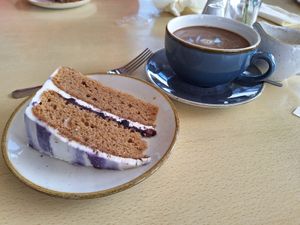 Blueberry cake and coffee with oat milk at Gallie Craig Coffee House in Stranraer