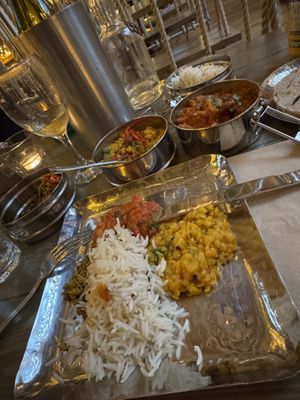 Cardamom rice, tarka dahl, bombay potato, chapatis & vegan wine  at Mowgli in Edinburgh