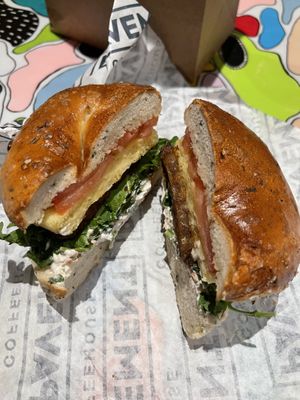 Rosemary salt bagel, arugula, tomato, veggie tofu spread, just egg & tempeh baconn  at Pavement Coffeehouse - Newbury in Boston