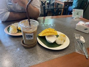 Iced oat latte and mango sticky rice   at Kin & Koff Café in Bangkok