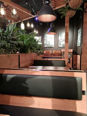 Interior seating facing place to put waste at Frittenwerk - Alexa Mall in Berlin