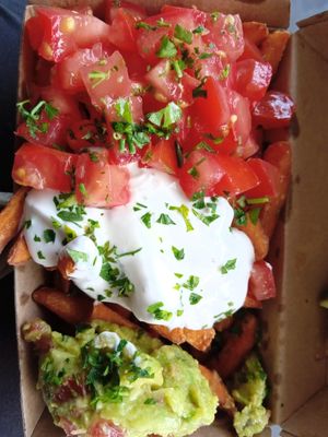 sweet potato fries, guacamole, vegan sour cream, tomatoes at Frittenwerk - Hbf Münster in Muenster