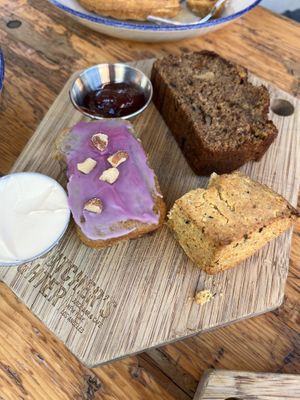 Bakery trio (banana bread, blueberry almond bread, rosemary scone with a bite missing!)  at The Butcher's Daughter - Nolita in New York City