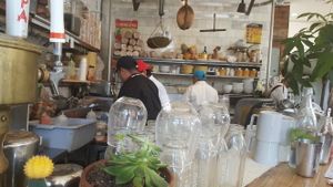 sitting at the bar at The Butcher's Daughter - Nolita in New York City