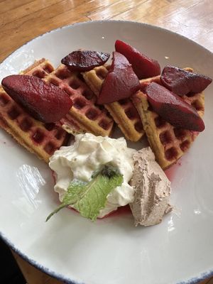 Beet waffles with house MAPLE BUTTER (the brown dollop) 🤤  at The Butcher's Daughter - Nolita in New York City