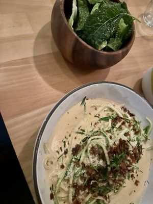 Bacon carbonara made vegan and a side of greens  at The Butcher's Daughter - Nolita in New York City