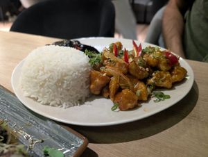 Crunchy cauliflower in orange sauce with mushroom salad and rice at Asian Street in Chisinau