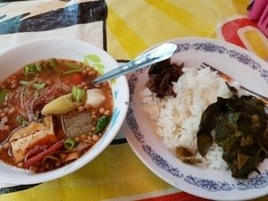 Tom yum soup with noodles and rice with mock meat  at Vegan Thai Food Stalls in Bangkok