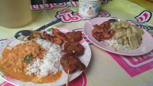 One Thai green curry, one Thai red curry and some mock meats. at Vegan Thai Food Stalls in Bangkok