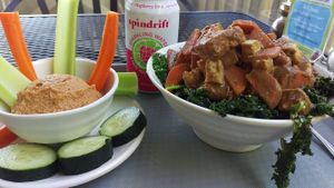 Tofu bowl with sesame kale and a side of hummus at Sunflower Cafe in Nashville
