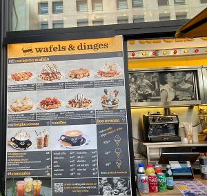 Wall menu…almost nothing is vegan, no mention of extra vegan charge at Wafels & Dinges in New York City