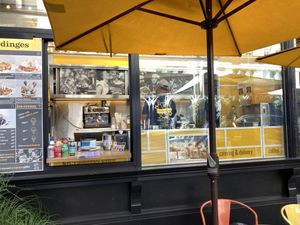 No indoor space; just a booth with tables in front at Wafels & Dinges in New York City