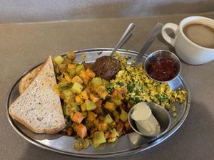 Tofu scramble, soysage, multigrain toast with vegan butter and jam, veggies  at Green Sage Cafe - South in Asheville