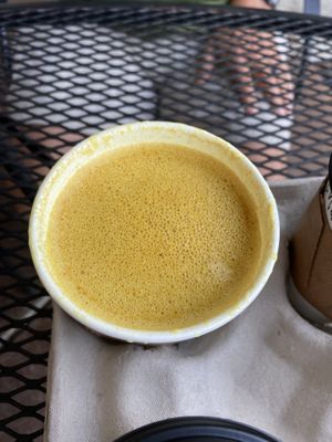 Golden milk latte made with oat milk  at Green Sage Cafe - South in Asheville