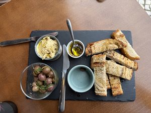 Olives, hummus, and breadd  at Mela Canela - Sintra Centre in Sintra