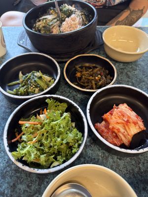 Various toppings from morning glory, seaweed, and kimchi   at YooJung SikDang - 유정식당 in Seoul
