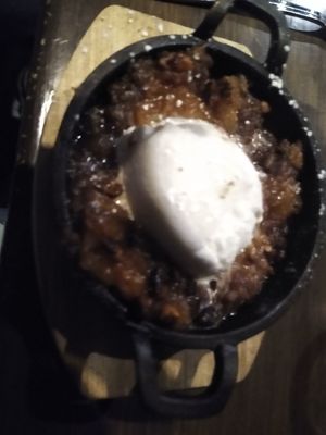 Peach pecan cobbler with vegan ice cream at Indigo Cafe in Cleveland