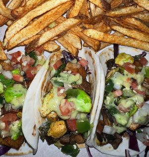 VEGAN TACOS
Sauteed Potatoes, Mushrooms, & Brussels Sprouts
w/ Red Cabbage, Pico De Gallo & Guac Sauce at Glo Jean's Kitchen in Homewood