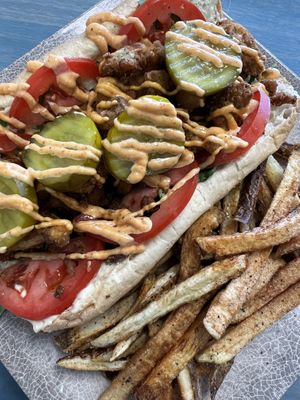 
VEGAN PO’ BOY
Fried Oyster Mushrooms w/ Vegan Mayonnaise, Lettuce, Tomatoes
Pickles, Vegan Cajun Sauce
 at Glo Jean's Kitchen in Homewood