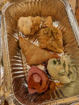 Spinach pie, hasselback potatoes, some other veggie parcels/fritters at Annie's Vegan Food and Bar - Pop-up in Rhodes