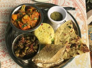 Mixed vegetables, okra, cilantro chutney, basmati rice with pomegranate seeds and spices, 2 different flatbreads at Marwari Indian Food in Tepoztlan