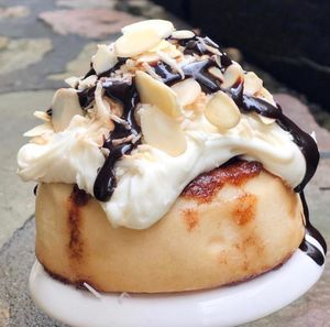 Caramel Frosting, Toasted Coconut, Almonds & Chocolate Sauce! at Cinnaholic in Edinburg