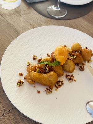 Malephi puffs w peach sorbet   at Oia Gefsis in Oia