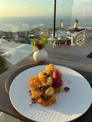 Delicious dessert with a view at Oia Gefsis in Oia