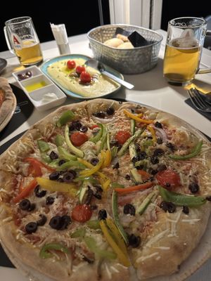 Vegan pizza with fava  at Flora in Oia