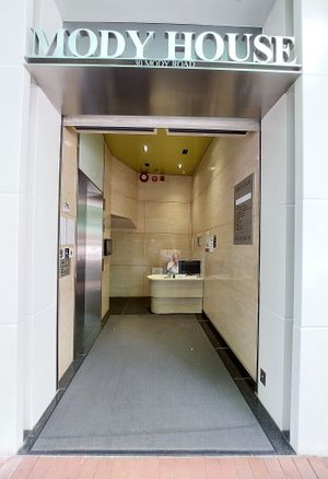 Entrance to the building at Kindness Gather - 慈素小聚 in Kowloon