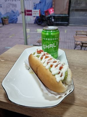 Happy completos, salchicha, pasta de palta, tomate en cubos y salsas at Happy Vegan Coffee in Santiago