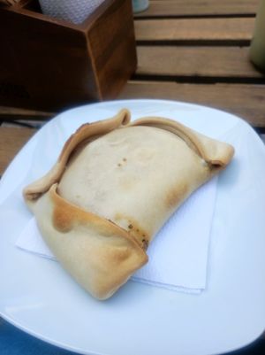 Empanada de seitán con queso y cebolla caramelizada at Happy Vegan Coffee in Santiago